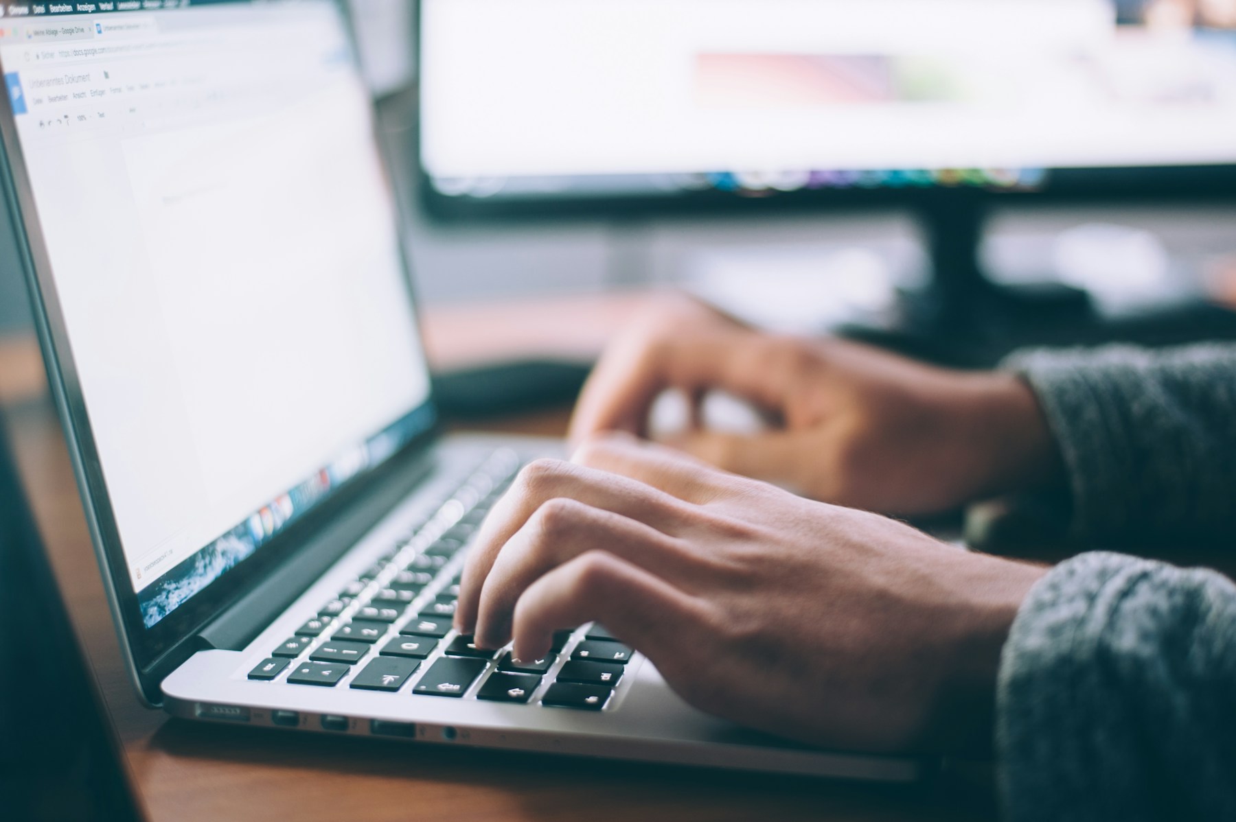 Professional working with documents on a laptop