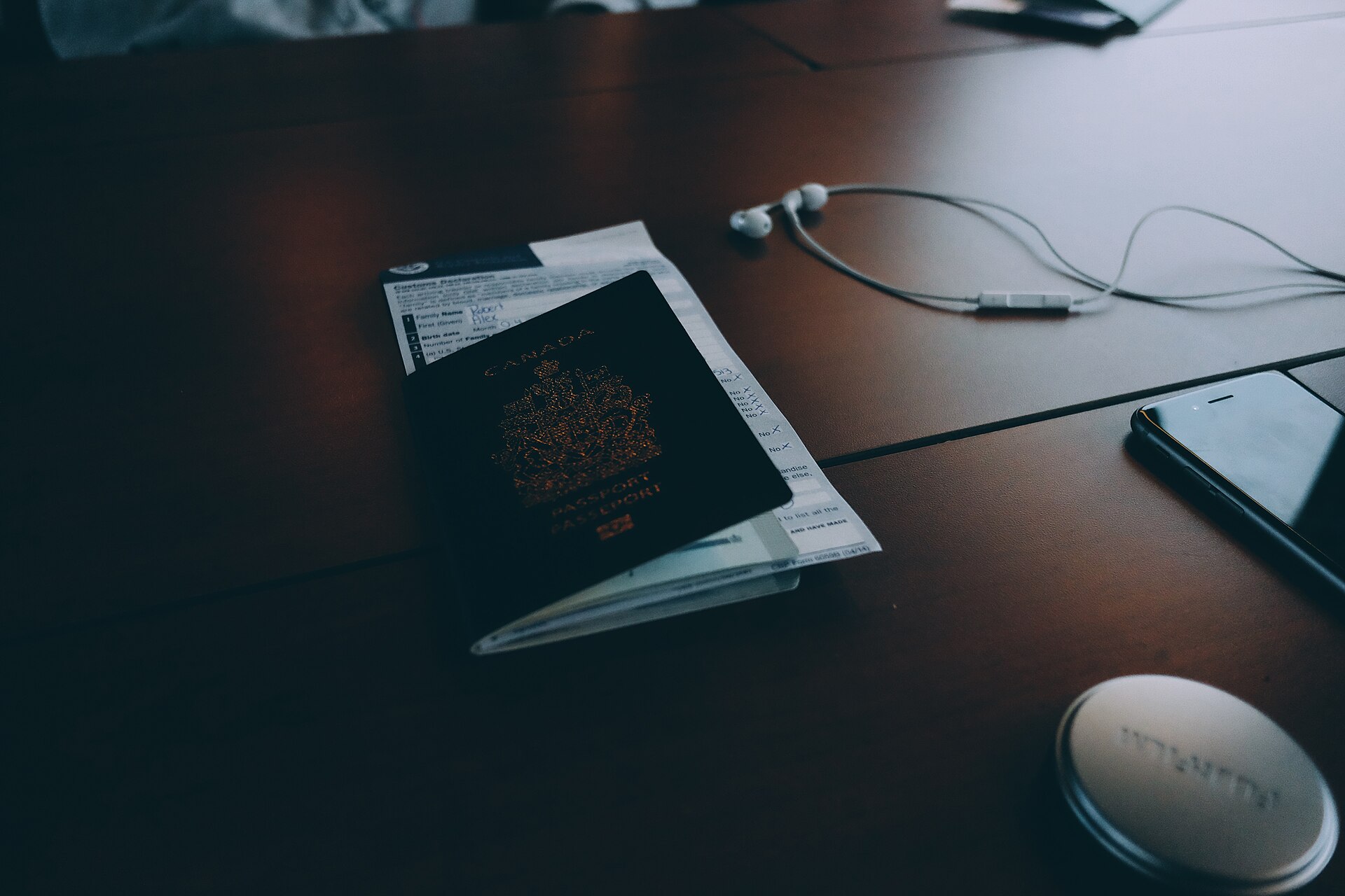 Passport and travel documents arranged on a desk